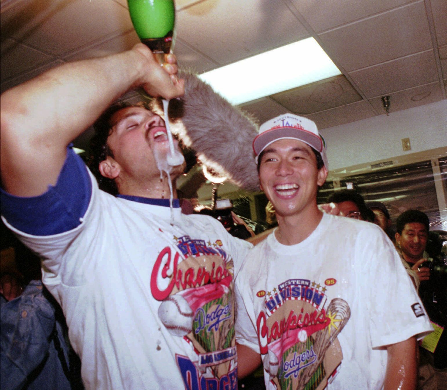 Piazza and Nomo share a sip